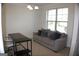 Well lit home office with neutral colored walls and carpet, and ample space for working at 878 W Union Grove Cir, Auburn, GA 30011