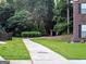The community has sidewalks lined by trees and greenery for an ideal walking and recreational area at 878 W Union Grove Cir, Auburn, GA 30011