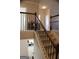 View of a staircase featuring wooden banister and iron balusters connecting multiple stories at 878 W Union Grove Cir, Auburn, GA 30011