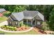 A detailed aerial view of a home showcasing its landscaping, and backyard at 150 Cold Harbor Ct, Sharpsburg, GA 30277