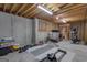 Spacious basement featuring workout area, exposed beams, and a concrete foundation at 150 Cold Harbor Ct, Sharpsburg, GA 30277