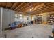 Unfinished basement with exposed beams and concrete floor offers ample potential for customization and storage at 150 Cold Harbor Ct, Sharpsburg, GA 30277