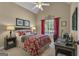Inviting bedroom with vaulted ceiling, plush bedding, and a dedicated workspace, offering both comfort and functionality at 150 Cold Harbor Ct, Sharpsburg, GA 30277