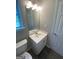Bright bathroom with a single sink vanity at 5678 Mill View Way, Lithonia, GA 30038