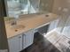 Bright bathroom with double sinks and a large bathtub at 5678 Mill View Way, Lithonia, GA 30038