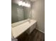 Bathroom featuring a large mirror, a vanity with ample counter space and storage, and modern lighting at 5678 Mill View Way, Lithonia, GA 30038