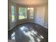 Bright breakfast nook with windows, hardwood floors and a hanging light fixture at 5678 Mill View Way, Lithonia, GA 30038