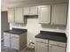Bright kitchen featuring gray cabinets and dark countertops at 5678 Mill View Way, Lithonia, GA 30038