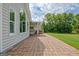 Brick patio that leads to the backyard showcasing the exterior of the home and the hot tub at 503 Atwood Cir, Peachtree City, GA 30269