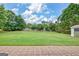 Expansive backyard featuring a large lawn and storage shed, ideal for outdoor activities at 503 Atwood Cir, Peachtree City, GA 30269