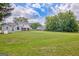 Expansive backyard featuring lush green lawn, a storage shed, and mature trees bordering the property line at 503 Atwood Cir, Peachtree City, GA 30269