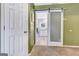 Stylish bathroom entrance with sliding door, leading to bright vanity and modern fixtures at 503 Atwood Cir, Peachtree City, GA 30269
