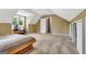 Bedroom showcasing a sloped ceiling, a light-filled window, and neutral wall colors at 503 Atwood Cir, Peachtree City, GA 30269