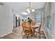 Bright dining area with wood table, chairs, and views to the modern kitchen with stainless steel appliances at 503 Atwood Cir, Peachtree City, GA 30269