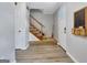 Foyer with staircase and modern flooring, offering a bright and welcoming entrance at 503 Atwood Cir, Peachtree City, GA 30269