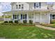 Beautiful home exterior with a welcoming front porch and well-maintained landscaping at 503 Atwood Cir, Peachtree City, GA 30269