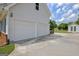 Spacious two-car garage with a shed, featuring a concrete driveway and ample parking at 503 Atwood Cir, Peachtree City, GA 30269