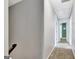 Upstairs hallway with carpet and several doors, one leading to a bright green room at 503 Atwood Cir, Peachtree City, GA 30269