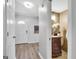Hallway view to the front door and a half bathroom with a furniture-style vanity at 503 Atwood Cir, Peachtree City, GA 30269