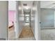 Hallway leading to bedrooms, showcasing neutral paint, and inviting access to the rooms at 503 Atwood Cir, Peachtree City, GA 30269