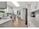 The modern kitchen features stainless steel appliances and quartz countertops at 503 Atwood Cir, Peachtree City, GA 30269