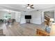 The spacious living room features wood floors, a ceiling fan, and an adjacent dining area at 503 Atwood Cir, Peachtree City, GA 30269