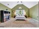 Inviting main bedroom features vaulted ceilings, large window, and decorative storage at 503 Atwood Cir, Peachtree City, GA 30269