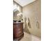 Elegant half bathroom features decorative walls, a furniture-style vanity, and a decorative mirror at 503 Atwood Cir, Peachtree City, GA 30269