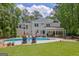 Spacious backyard with inground pool, patio, and mature trees at 111 Biltmore Trce, Peachtree City, GA 30269