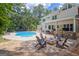 Beautiful home with backyard, pool, fire pit, and outdoor kitchen at 111 Biltmore Trce, Peachtree City, GA 30269