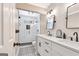 Bright bathroom featuring double sinks, modern fixtures, and walk-in shower at 111 Biltmore Trce, Peachtree City, GA 30269