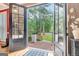 Inviting view through the glass paneled front door to the landscaped front yard at 111 Biltmore Trce, Peachtree City, GA 30269