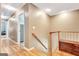 Hallway with hardwood floors and staircase at 111 Biltmore Trce, Peachtree City, GA 30269
