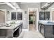 Luxurious main bathroom with double sinks, a large mirror and dark wood cabinets at 111 Biltmore Trce, Peachtree City, GA 30269