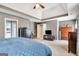 Spacious main bedroom with a tray ceiling and a view of the ensuite bathroom at 111 Biltmore Trce, Peachtree City, GA 30269