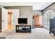 Bedroom features a wooden armoire, a television and neutral carpet at 111 Biltmore Trce, Peachtree City, GA 30269