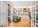 Cozy home office with custom built-in bookshelves, ample natural light, and hardwood floors at 111 Biltmore Trce, Peachtree City, GA 30269