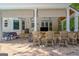 Covered outdoor kitchen with stainless steel grill, bar seating and patio at 111 Biltmore Trce, Peachtree City, GA 30269