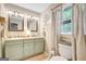 Bright bathroom featuring a double sink vanity, modern lighting, and a toilet at 29 Clark Pl, Whitesburg, GA 30185