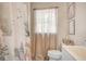 Stylish bathroom with a custom shower curtain and modern fixtures at 29 Clark Pl, Whitesburg, GA 30185
