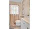 Bright bathroom featuring a sink with vanity, toilet, and window with natural light at 29 Clark Pl, Whitesburg, GA 30185