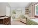 Decorated bedroom with mural, crib, love seat and dresser at 29 Clark Pl, Whitesburg, GA 30185