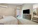 Cozy bedroom featuring a mini-split system, flatscreen tv, sliding glass doors and staircase to another level of the home at 29 Clark Pl, Whitesburg, GA 30185