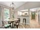 Dining area featuring a round table, stylish chairs, and views into the kitchen at 29 Clark Pl, Whitesburg, GA 30185