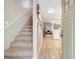 Bright entryway with staircase and views into the living room, offering a welcoming feel at 29 Clark Pl, Whitesburg, GA 30185