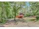 Charming home surrounded by lush greenery and tall trees, offering privacy and tranquility at 29 Clark Pl, Whitesburg, GA 30185