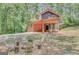 Cozy house with chairs around the outdoor fire pit, perfect for relaxing and entertaining guests at 29 Clark Pl, Whitesburg, GA 30185