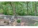 Cozy firepit area with Adirondack chairs, perfect for outdoor gatherings and relaxation at 29 Clark Pl, Whitesburg, GA 30185