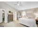 Spacious bedroom featuring a large bed, vaulted ceiling, and walk-in closet at 29 Clark Pl, Whitesburg, GA 30185