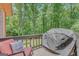 Outdoor patio sitting area with a grill and seating at 29 Clark Pl, Whitesburg, GA 30185